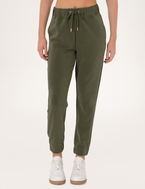 Брюки спортивные на манжетах зауженные - 